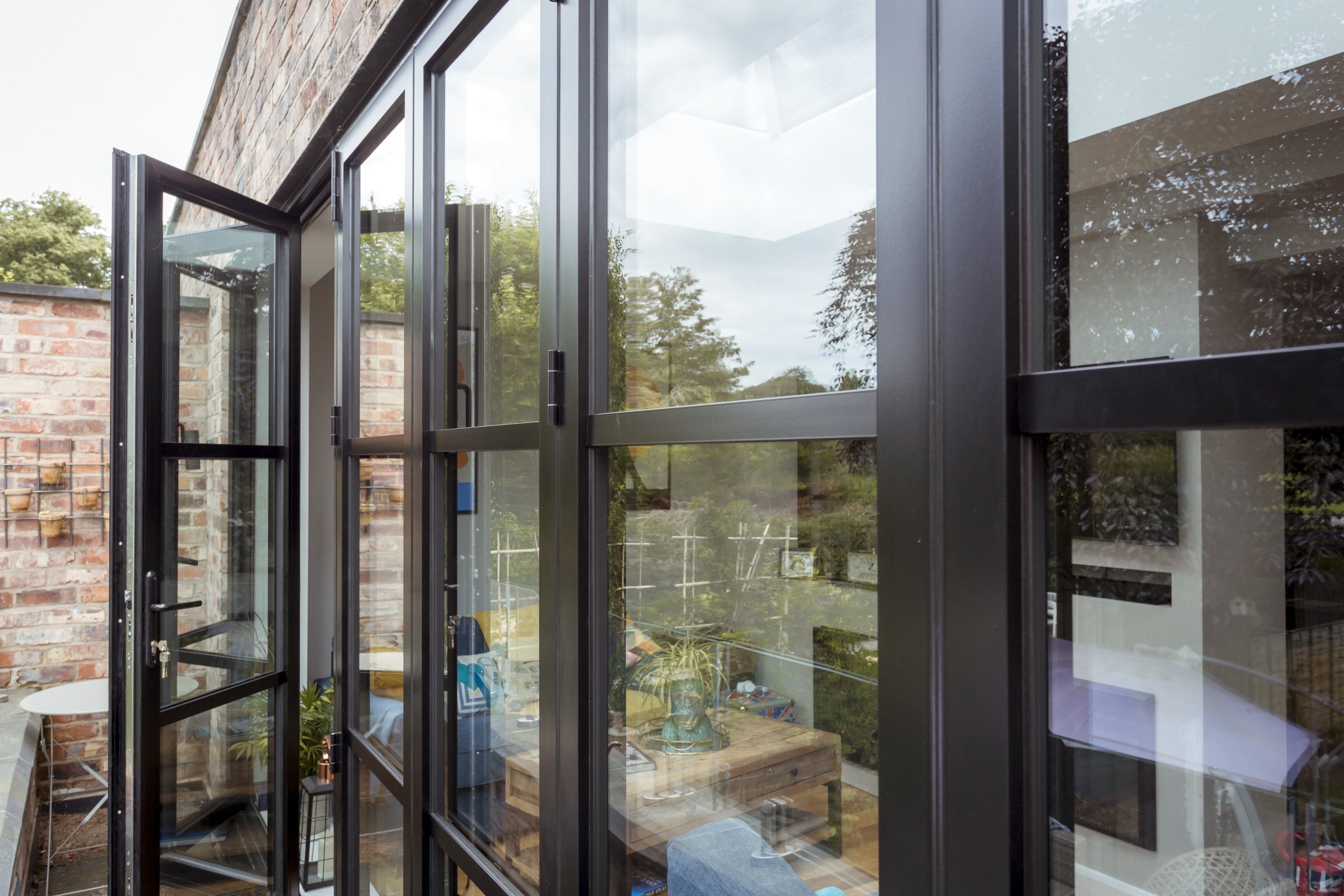 heritage style bifold doors with traffic door
