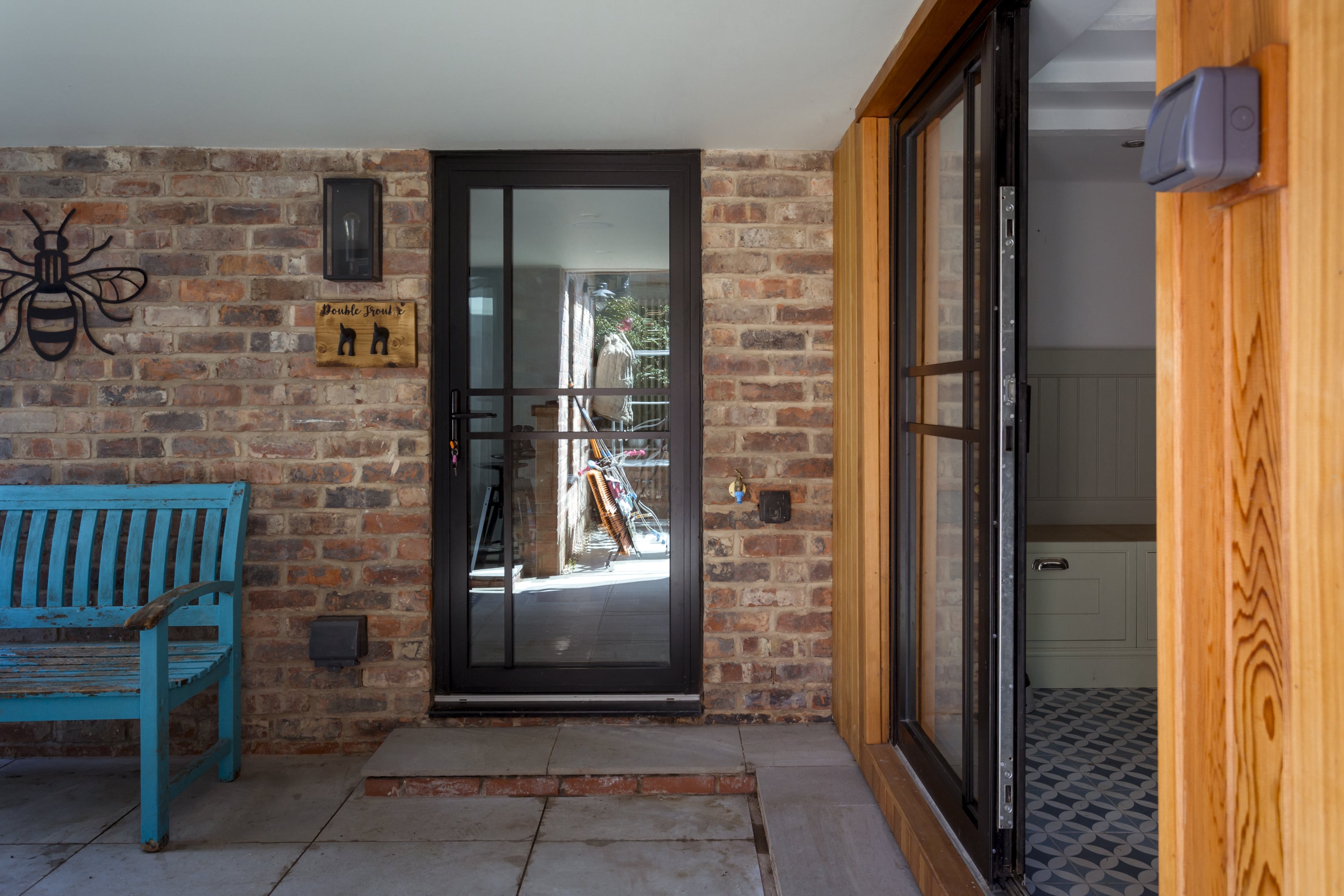 single glass door with heritage style bars
