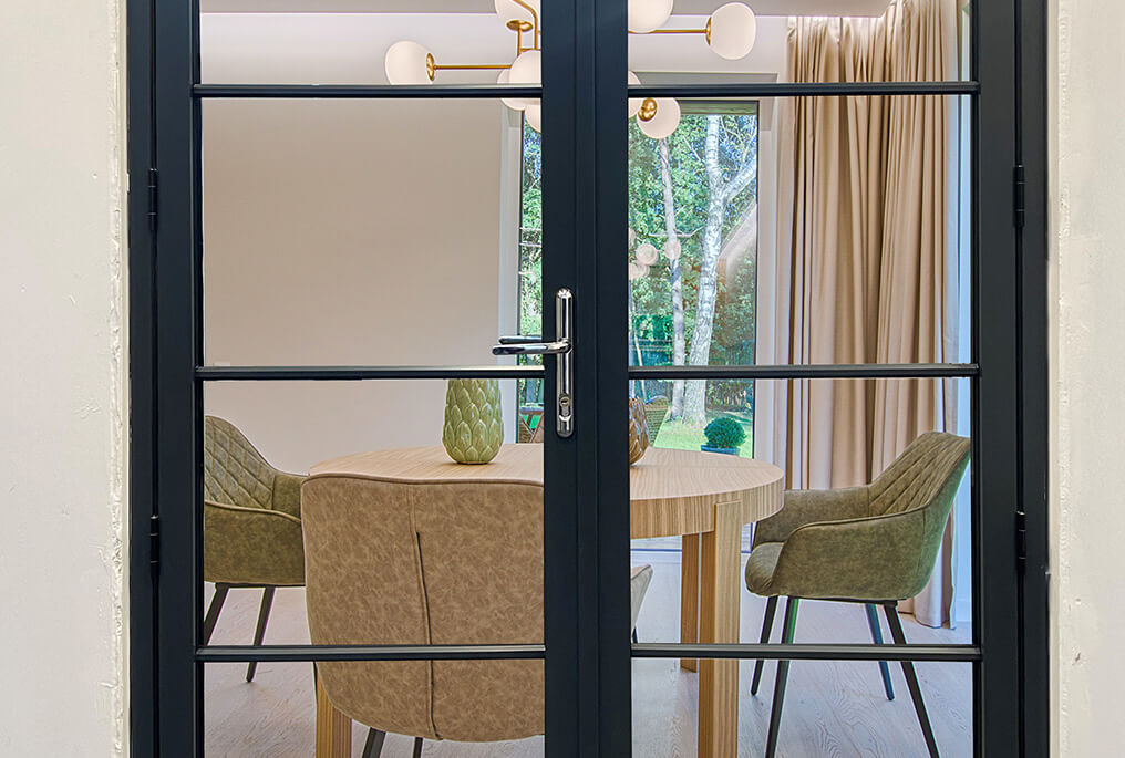 aluminium French doors with heritage style bars in dining room