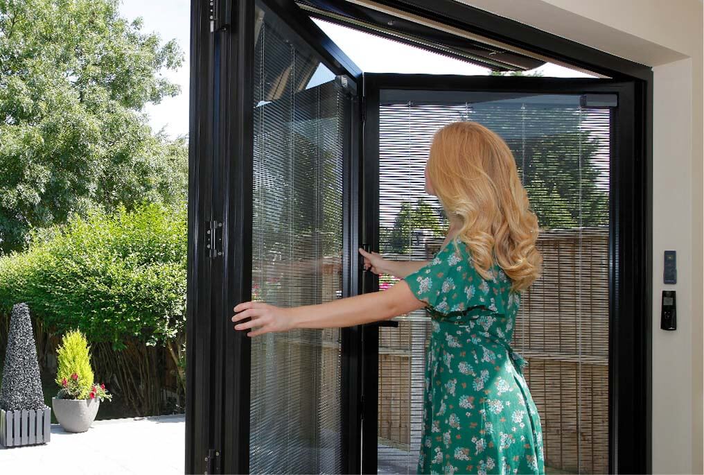 women opening bifolding door