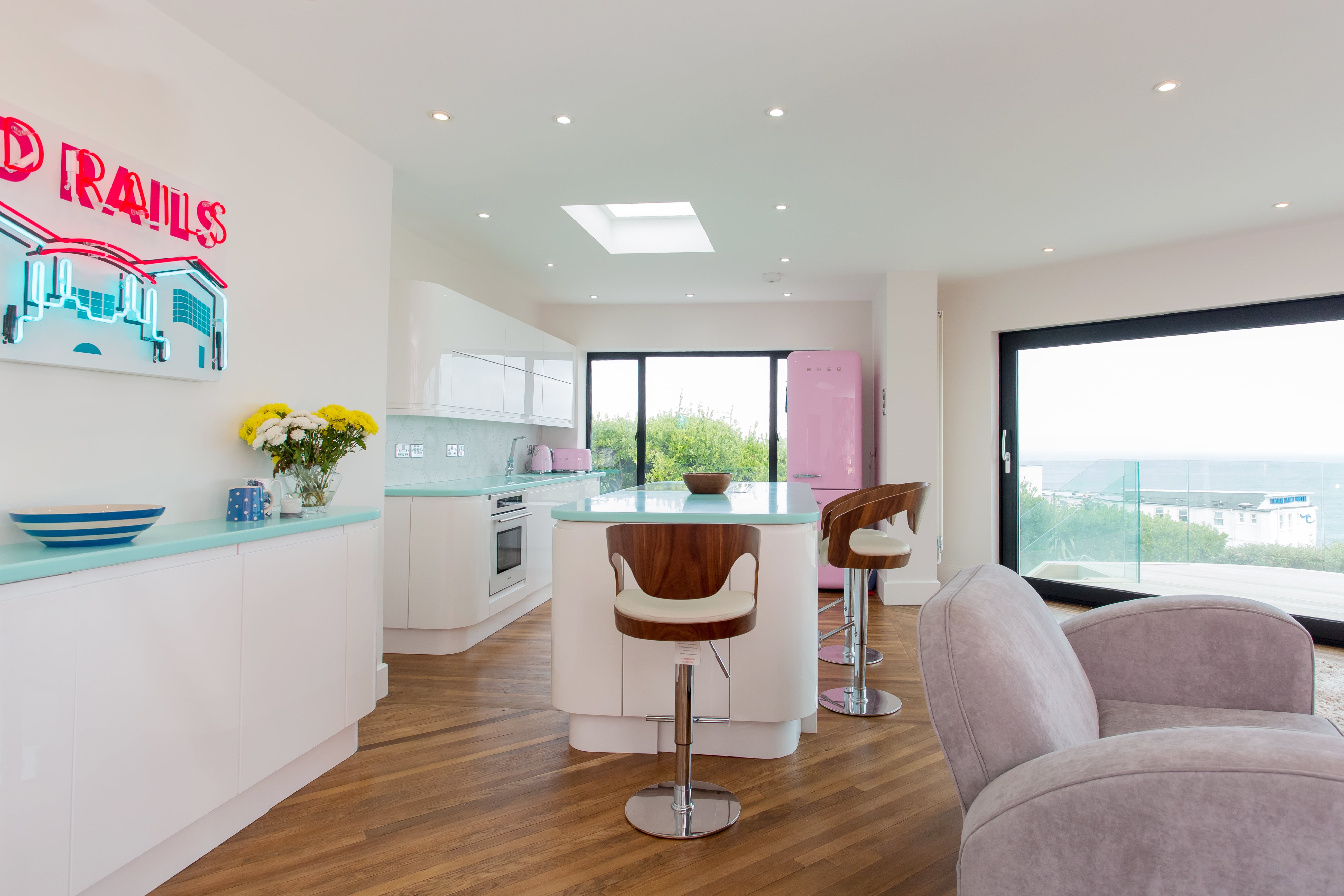 interior with kitchen island, large glass door and roof lantern